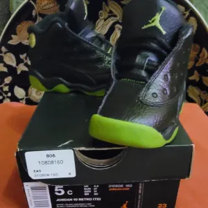 Black High-Top Sneakers with Neon Sole and Metallic Accents