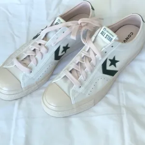Converse White and Green Athletic Shoes with Chevron Logo