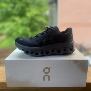 On Running Black Athletic Shoes with Cloud Cushioning